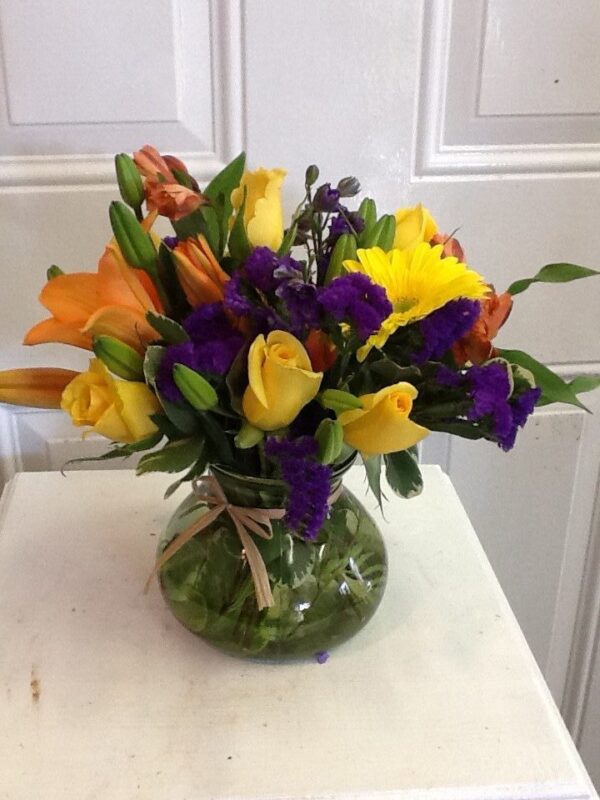 A vase filled with flowers on top of a table.