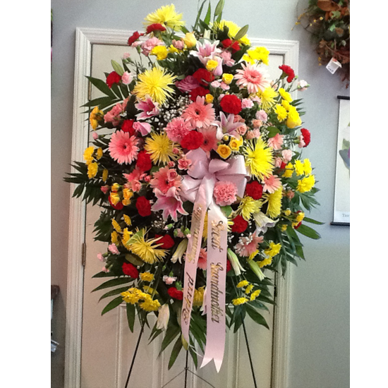A large floral arrangement on display in front of the door.
