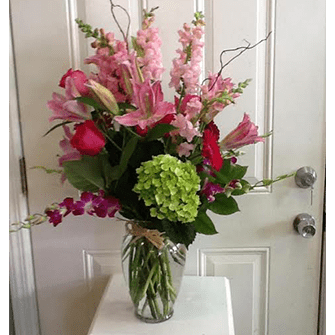 A vase of flowers on the door way