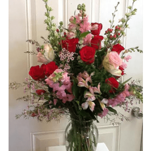 A vase filled with flowers on top of a table.