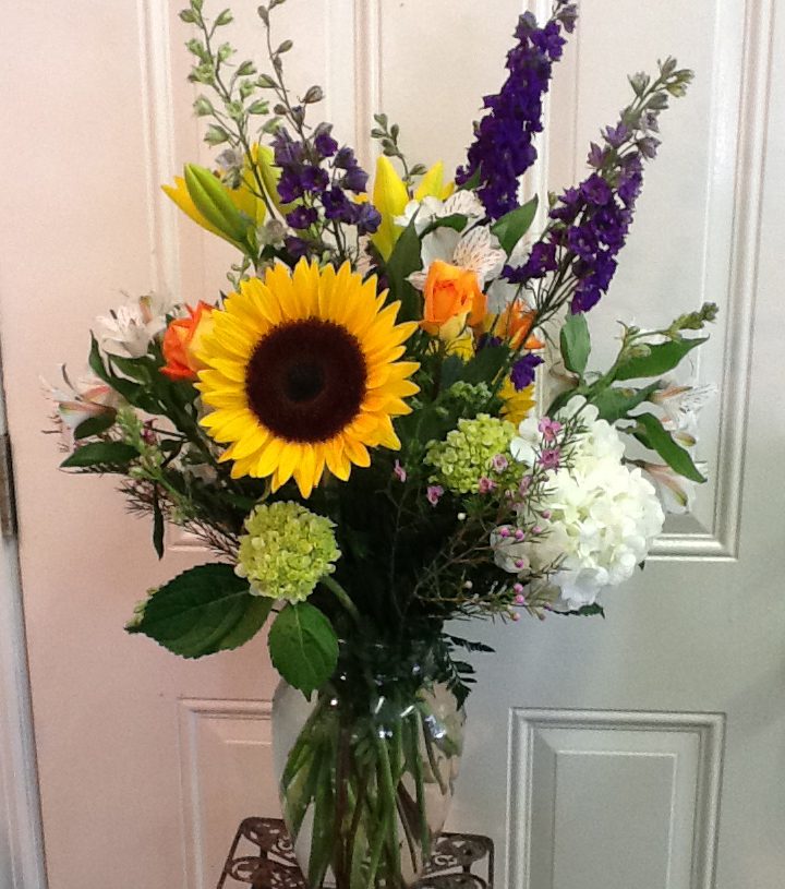 A vase filled with flowers sitting on top of a table.